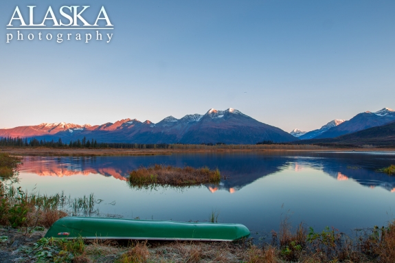 A canoe sits along the shore at the end of Robe Lake.