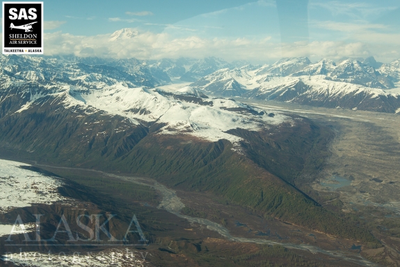 Kanikula Creek on one side with the moraines of Tokositna Glacier on the other, all beneath Denali (Mt McKinley).