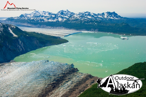 Alsek Glacier flows up from the bottom to meet Grand Plateau Glacier in Alsek Lake, with Deception Hills in the background. July 2009.