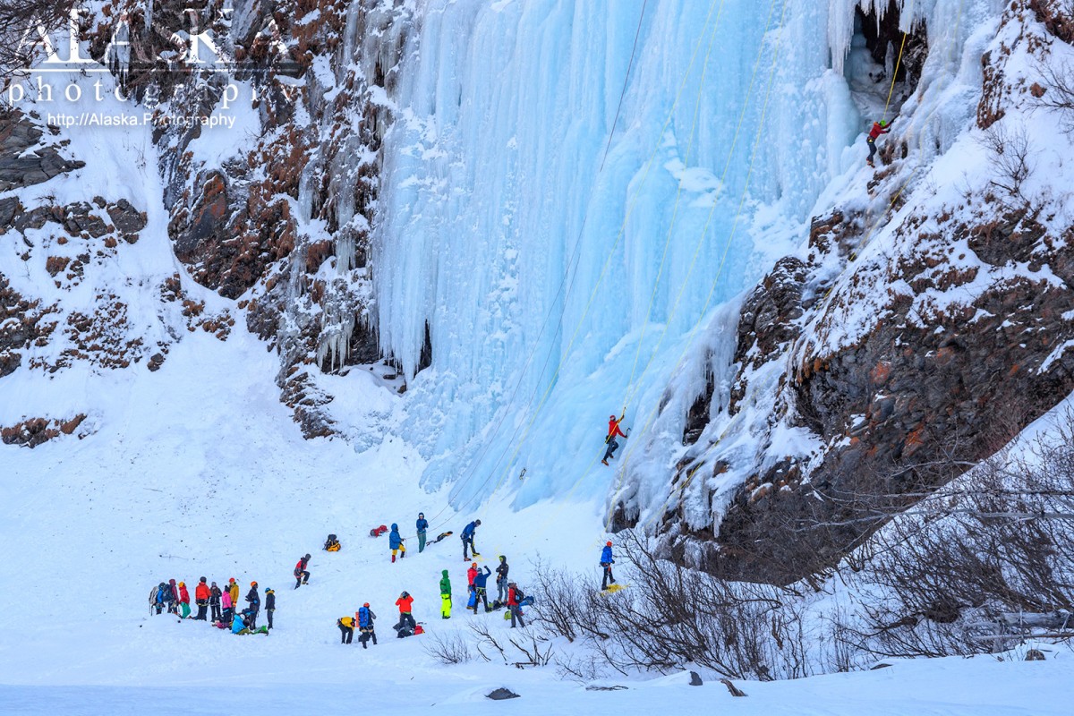 Climbers stand and the base of Bridal Veil Falls during the Valdez Ice Climbing Festival