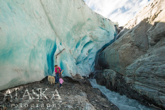 A family walks around the base of Worthington Glacier.