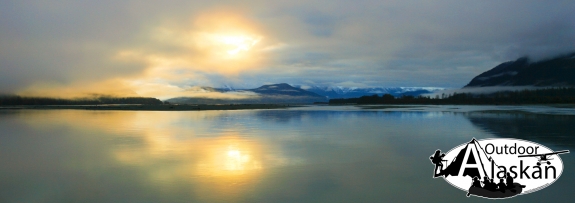 Looking down the Chilkat River as the sun rises above Mount Riley.
