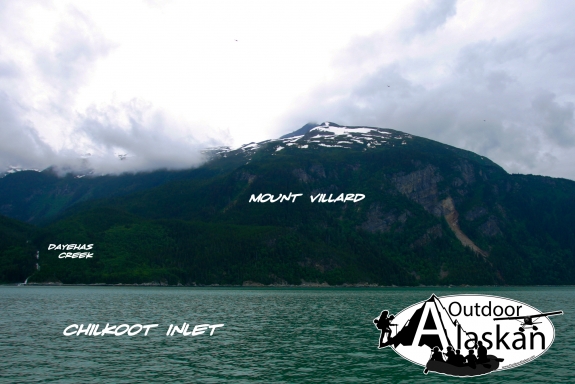 Dayehas Creek flows along the north side of Mount Villard and in to Chilkoot Inlet. Three helicopters are flying over Villard but hard to see.