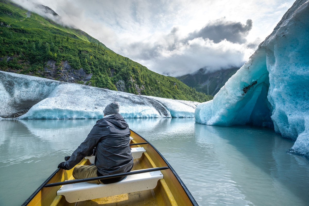 Canoeing back around Valdez Glacier on a tour looking at an ice cave.