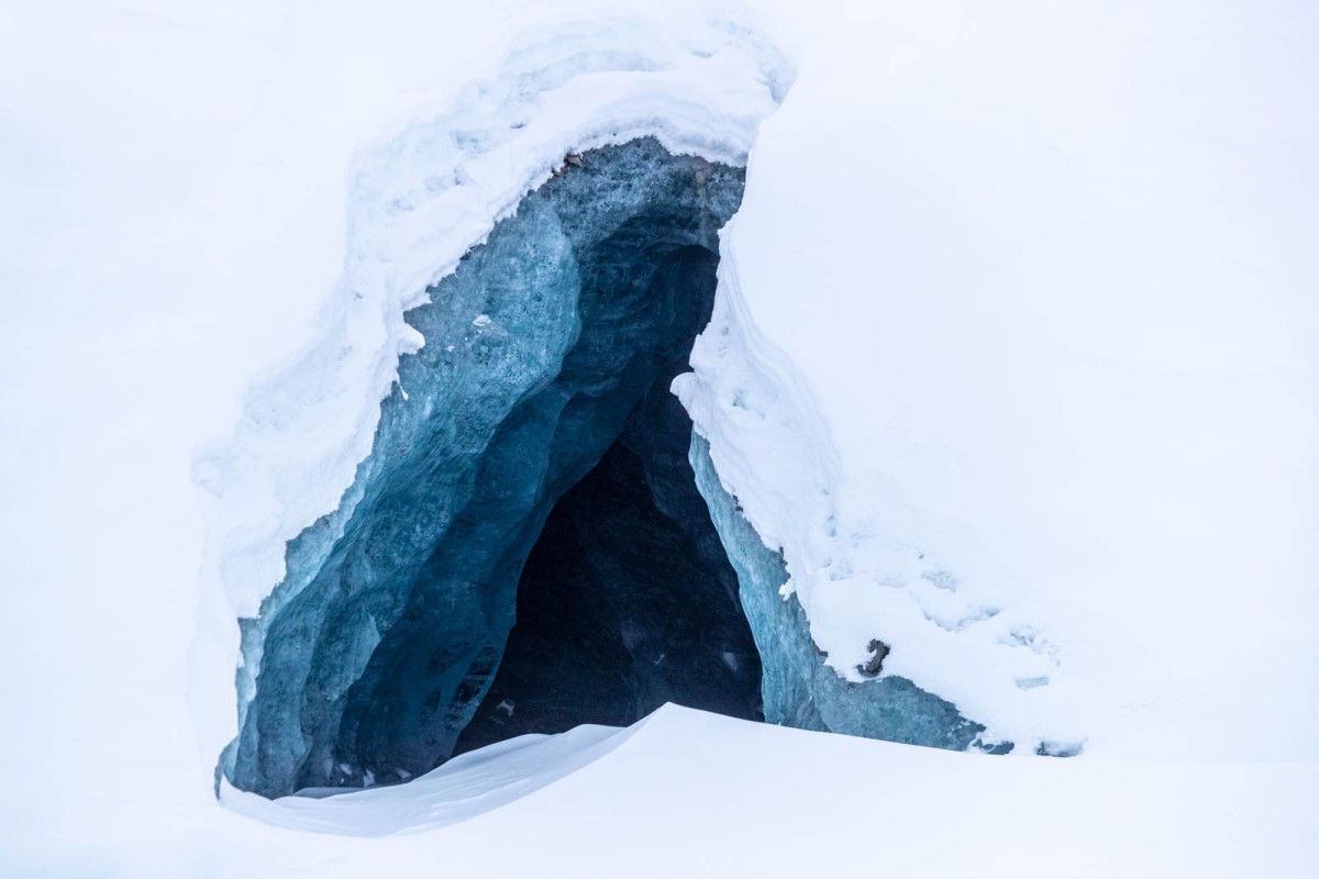 A cave tucked back behind the main icebergs.