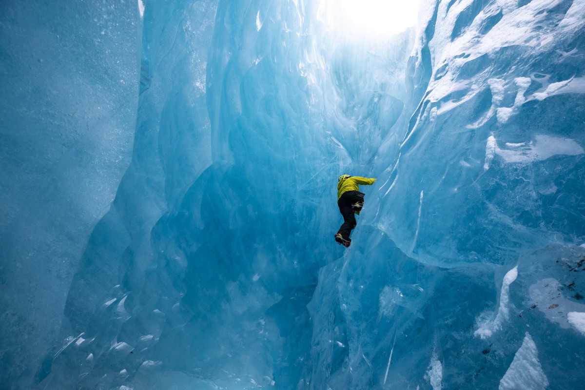 Ice climbing towards the light from the center of an iceberg.