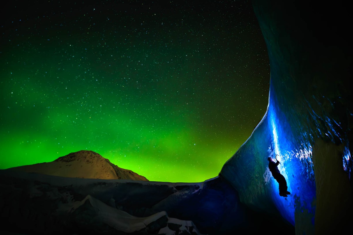 Ice climbing under the northern lights.