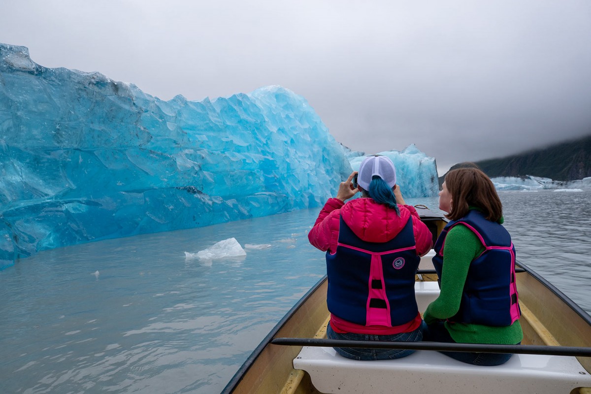 Looking at an iceberg that recently rolled out at Valdez Glacier on tour.