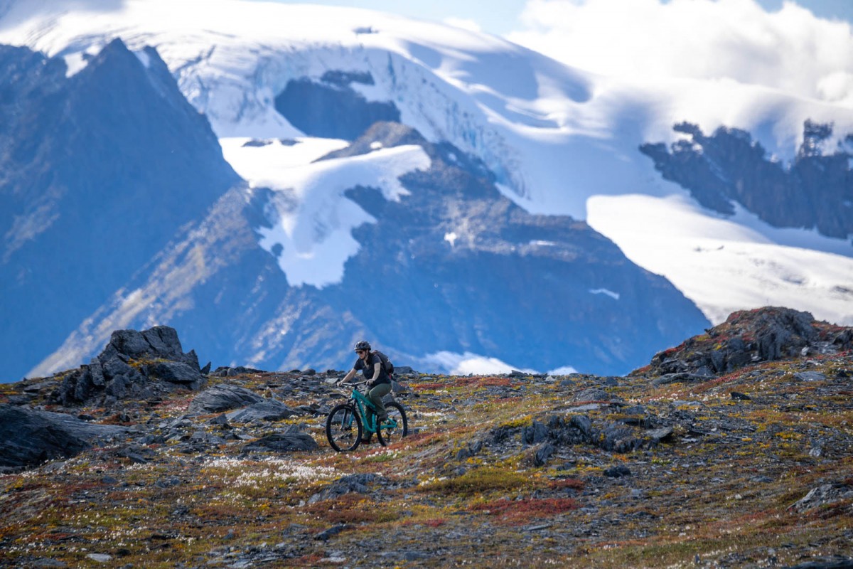 Riding out in the mountains with dramatic peaks and glaciers.