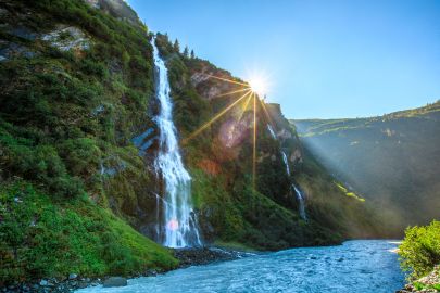 The sun peaks out around Bridal Veil Falls, in Keystone Canyon. A highlight to the Valdez Sea to Sky Cruise Excursion tour.