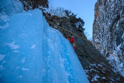 Climbing the blue ice in Keystone Canyon with the Valdez Winter Ice Climbing Tour.