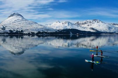 Out doing stand up paddle boarding tours on Port Valdez on a calm winters day.