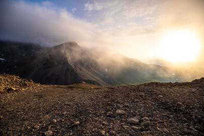 The sun peaks through the low clouds that moved in