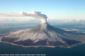 A gas plume arising from Augustine Volcano during it's eruptive phase 2005-06. This photo was taken during  a FLIR/maintenance flight on January 24, 2006. Cyrus Read, USGS, Alaska Volcano Observatory. Public domain