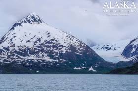 Looking out at Baird Peak and Burns Glacier on an overcast summer day at Portage Lake.