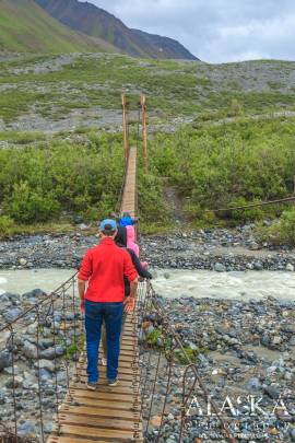 Crossing College Creek on the Gulkana Glacier Trail bridge.