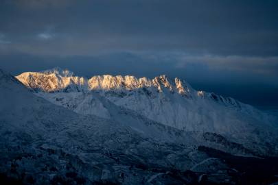 Sunrise illuminates Mummy Mountain in Valdez.