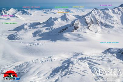 From above Martin River Glacier and Steller Glacier, looking out at Waxell River, Robinson Mountains, Khitrov Hills, Bering Glacier, Grindle Hills, and Suckling Hills.