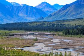 A shuttle bus crosses Teklanika River in Denali National Park.