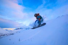 Catching some air in the last remaining light of the day. Racing down so we don't have to skin out in the dark.