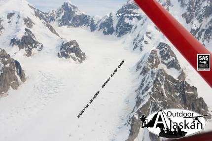 Looking down on the remains of the Kahiltna Galcier Base Camp for climbing Denali/Mount McKinley, at the end of the climbing season. Also the north face of Mount Hunter.